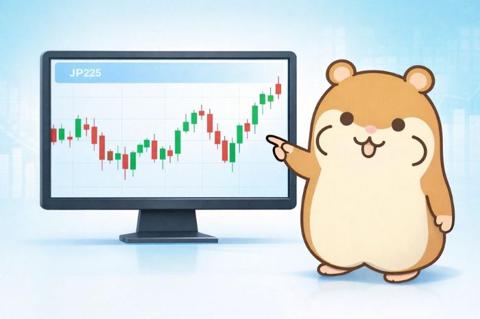 ハムスターが日経225の株価チャートが表示されたモニターを指し示している